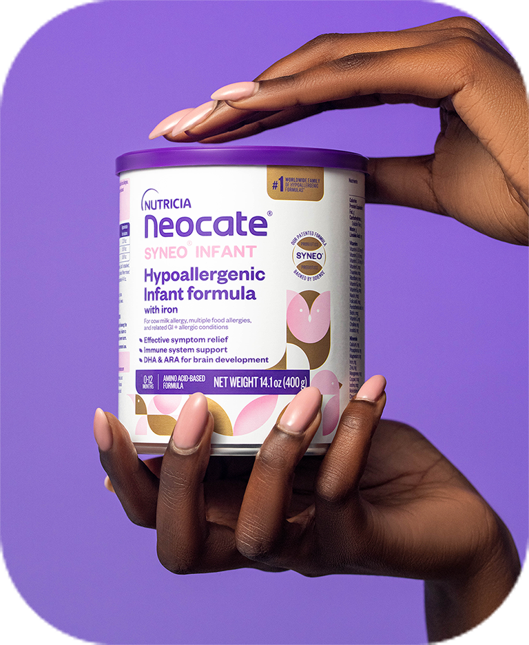 Hands holding a can of Neocate formula