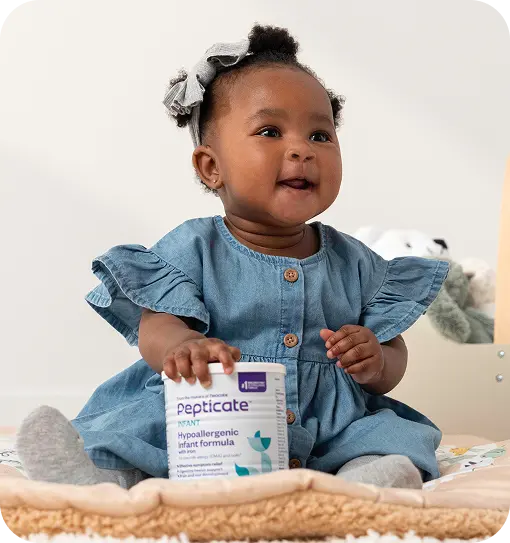 A baby sitting with a can of Pepticate formula