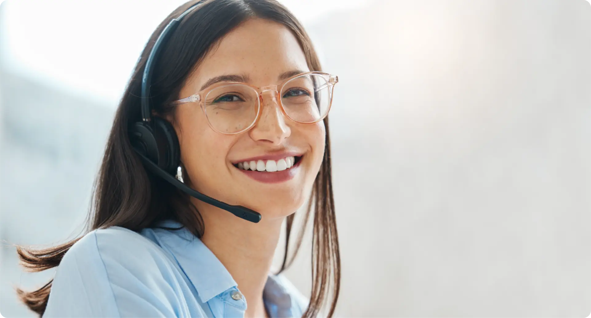 A customer service representation smiling